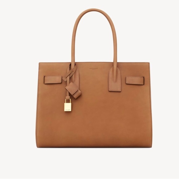 SAINT LAURENT 
SAC DE JOUR IN SUPPLE VEGETABLE LEATHER - Picture 1 of 10